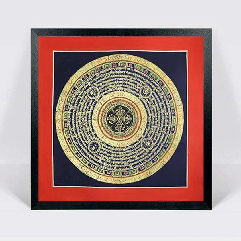 Framed Buddhist mandala thangka scroll with black picture frame and red mat border – displayed sacred spiritual artwork for home décor