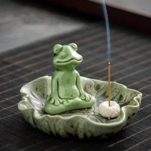 Handcrafted ceramic frog incense burner with lotus leaf tray, meditating frog design on bamboo mat, retro green glaze
