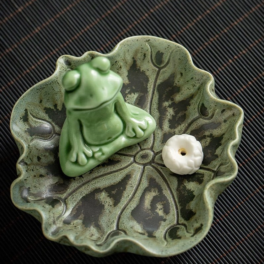 Lotus leaf embossed ceramic incense tray with frog design, two-tone weathered green glaze overhead view
