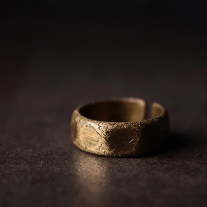 Frosted copper brass wealth ring right side close-up showing warm bronze tone and etched hammered texture
