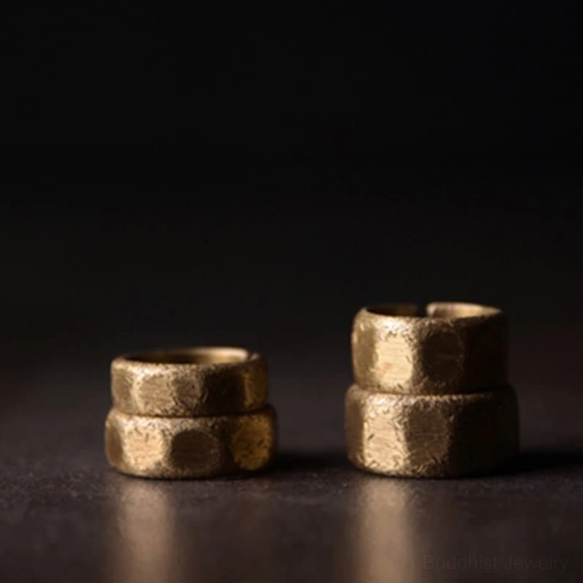 Two frosted copper brass wealth rings stacked display showing matching hammered texture and adjustable open cuff design