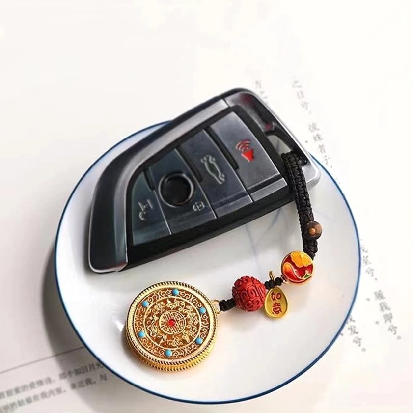 Buddhist Fu blessing keychain with cloisonné enamel beads and metal tag showing authentic handcrafted quality