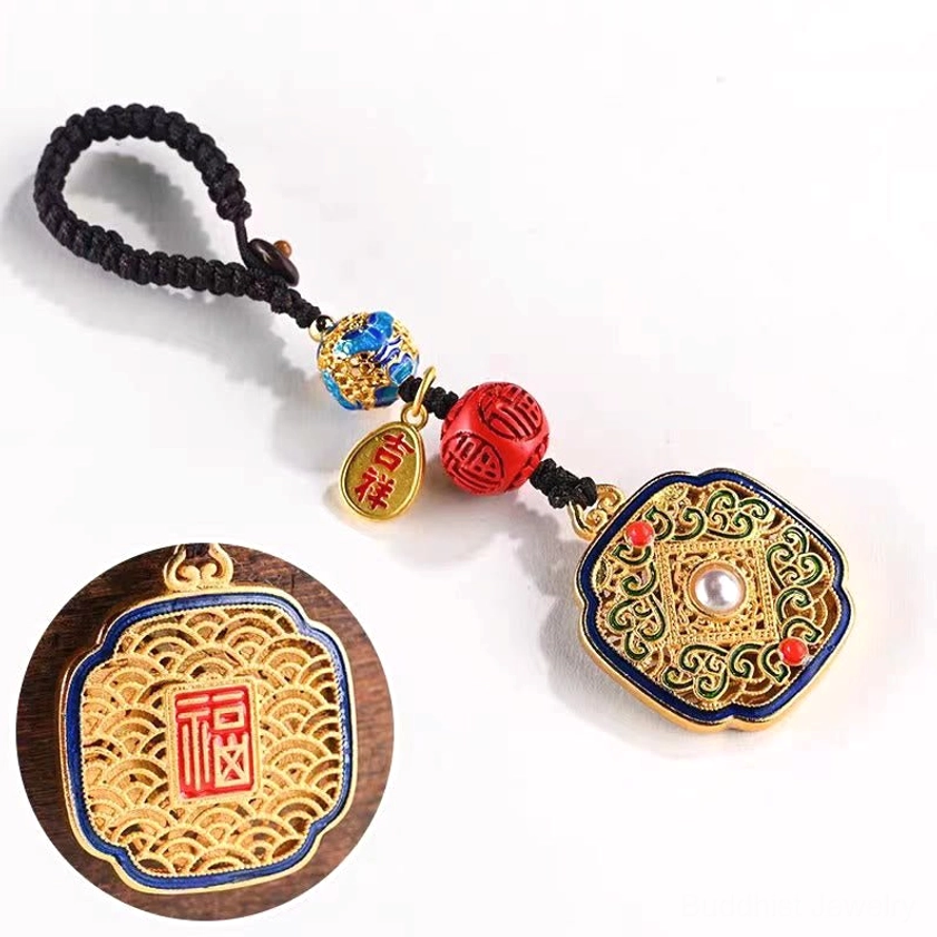 Buddhist blessing keychain with square filigree pendant and close-up detail shot showing cinnabar-style beads and metalwork