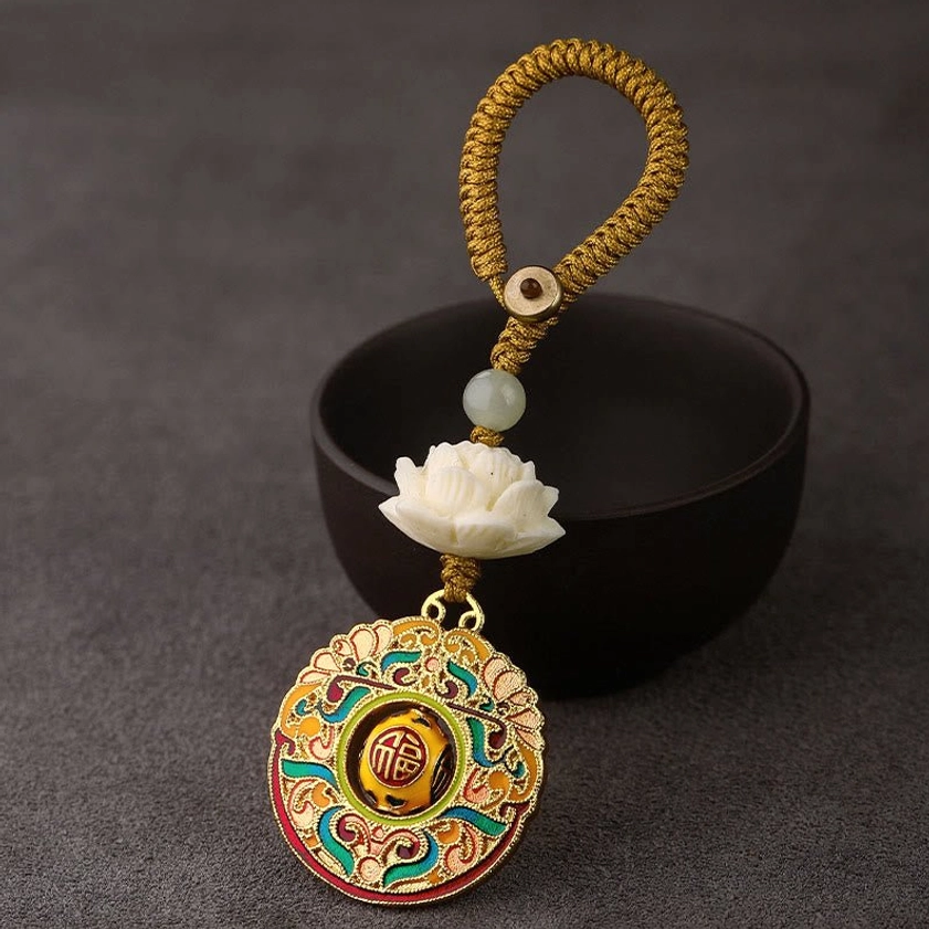 Fu character happiness blessing keychain with yellow braided button rope and rotatable copper pendant detail