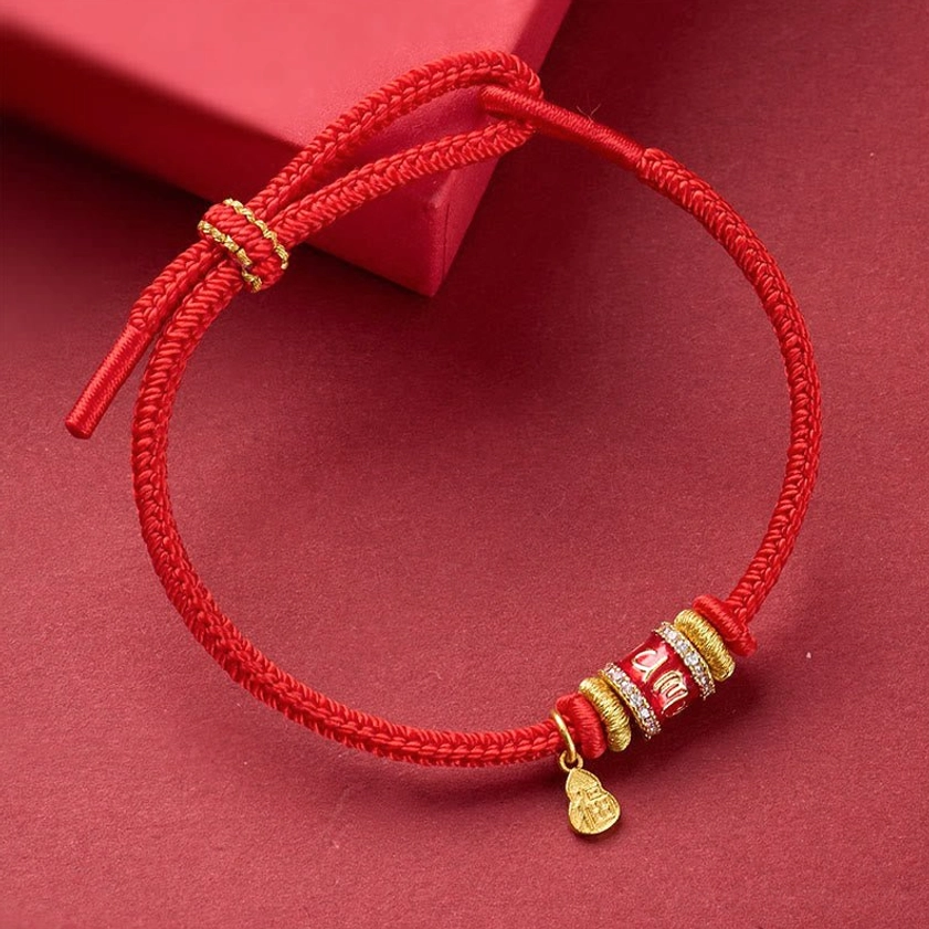 Sacred Buddhist red string Fu charm bracelet with copper accents and gift box angled view