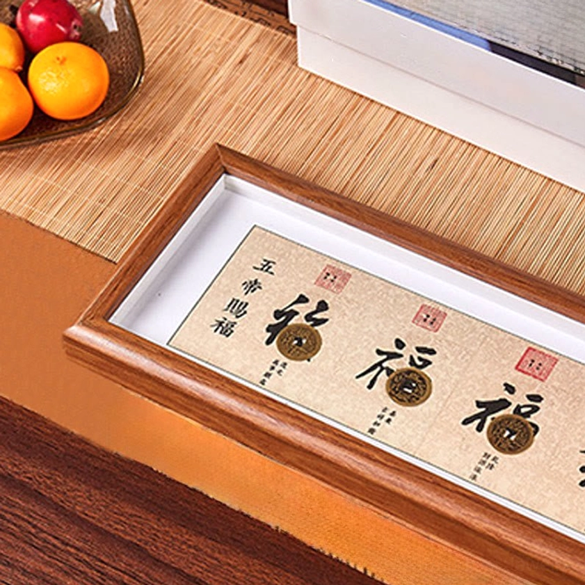 Fu Character photo frame with Five-Emperor Coins displayed on dining table with traditional Chinese home decor