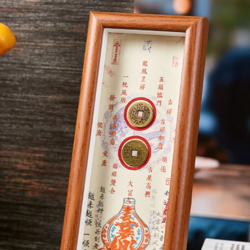 Close-up detail of Fu character wooden frame with decorative brass copper coins