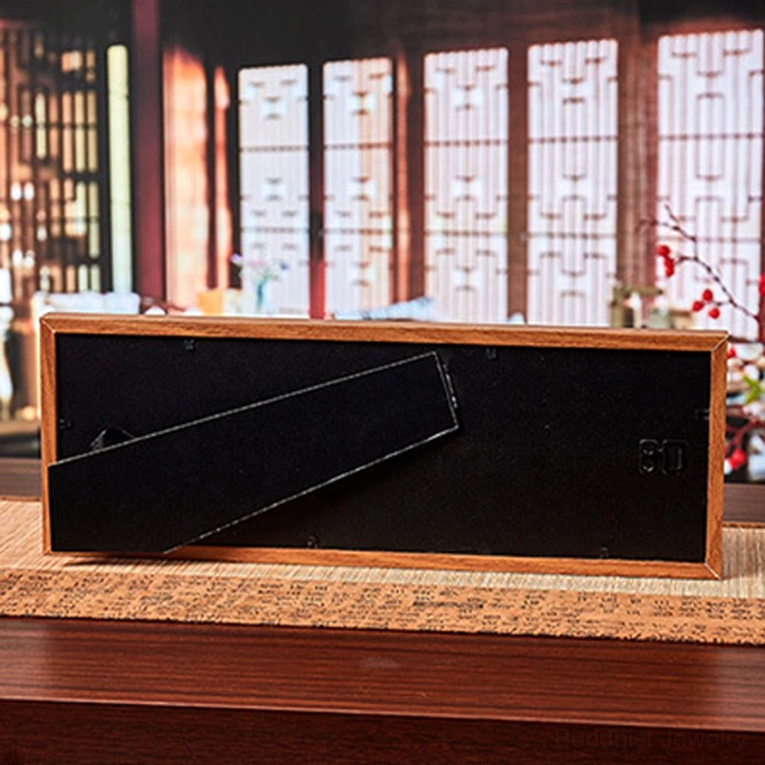 Back view of Five-Emperor Coins Fu frame showing black backing board and built-in stand for desktop placement