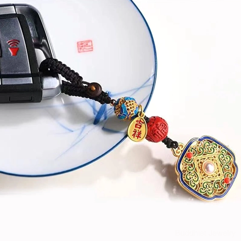 Fu character keychain attached to car key on porcelain plate featuring pearl-inlaid square pendant with red and blue decorative beads