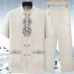Beige Fu symbol Tang suit set for men with Chinese knotwork embroidery and frog buttons, front flat lay view