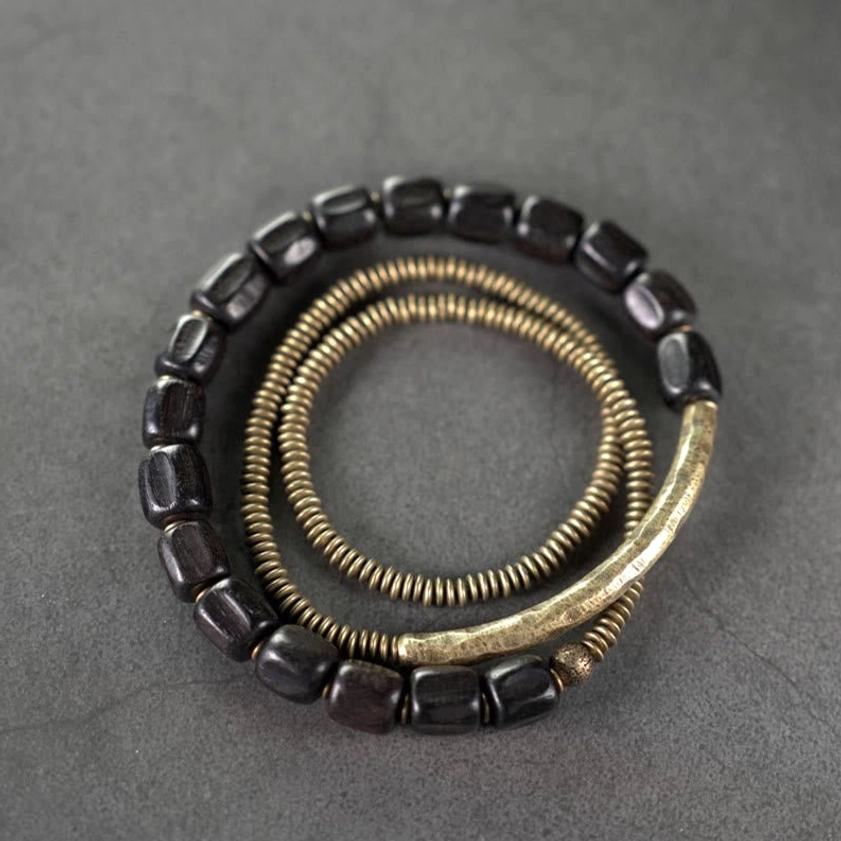 Full three-strand Buddhist bracelet set arranged together showing all layers