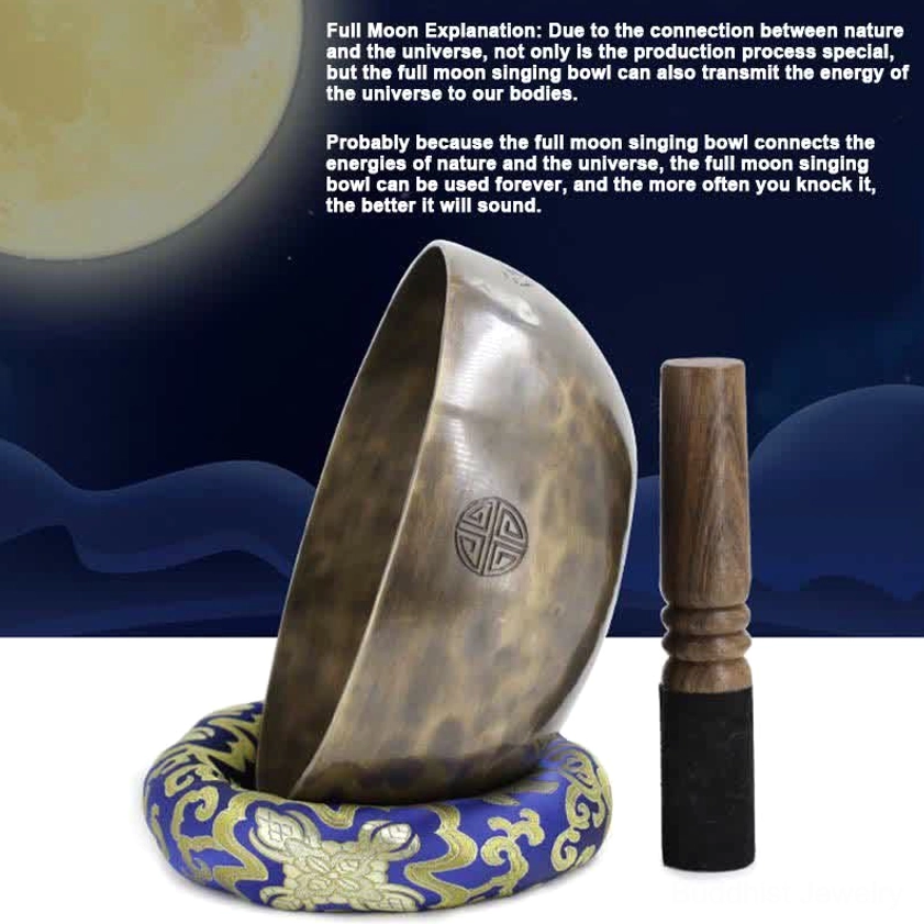 Full moon singing bowl with embroidered cushion and wooden mallet side view