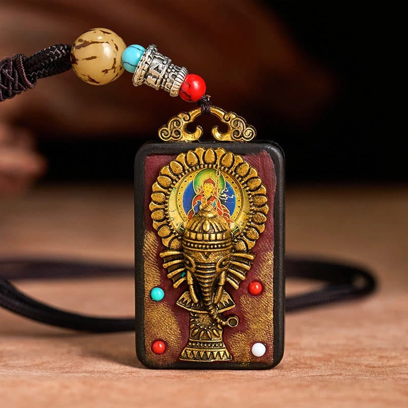 Premium ebony wood Ganesha elephant pendant with decorative rope and metal components
