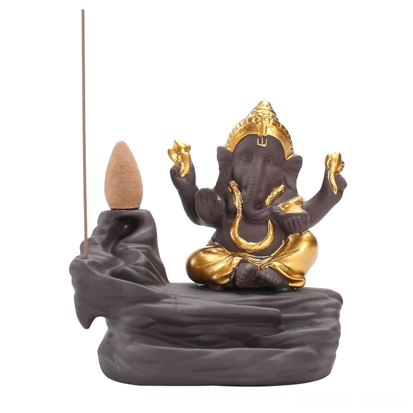 Ganesha gold backflow incense burner with incense stick and cone on purple clay base, complete setup view