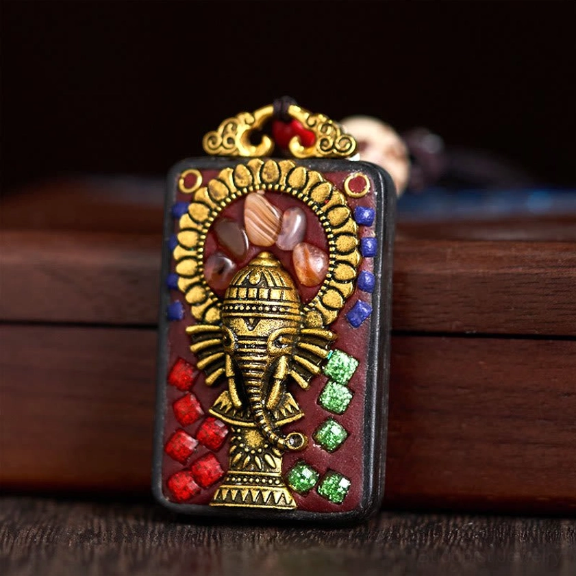 Ganesha elephant pendant showing metal hardware and decorative bead work details