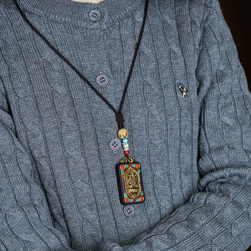 Ganesha pendant necklace detail showing rope cord quality and pendant attachment