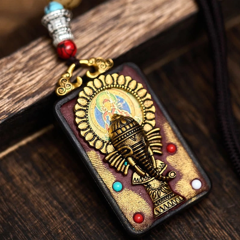 Style B variant of handcrafted Ganesha wooden pendant with unique carving design
