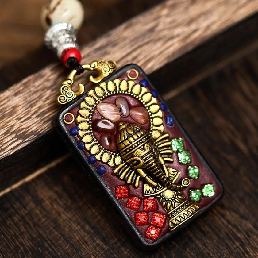 Style C variant of Ganesha wooden pendant with unique artisan carving and turquoise inlay