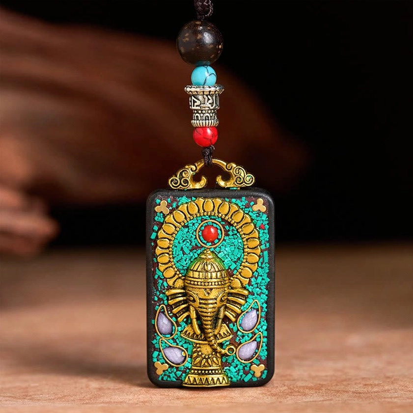 Front view of complete Ganesha pendant necklace with multi-layered decorative beads and metal mount