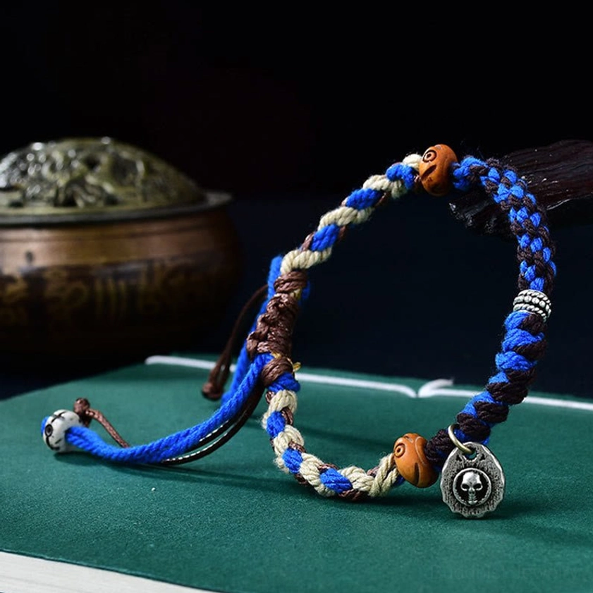 Hand-woven Garuda Buddhist string bracelet adjustable design with protective symbol and natural materials