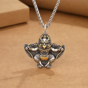 Garuda Bird copper Buddhist protection pendant necklace flat lay top view with wheat chain