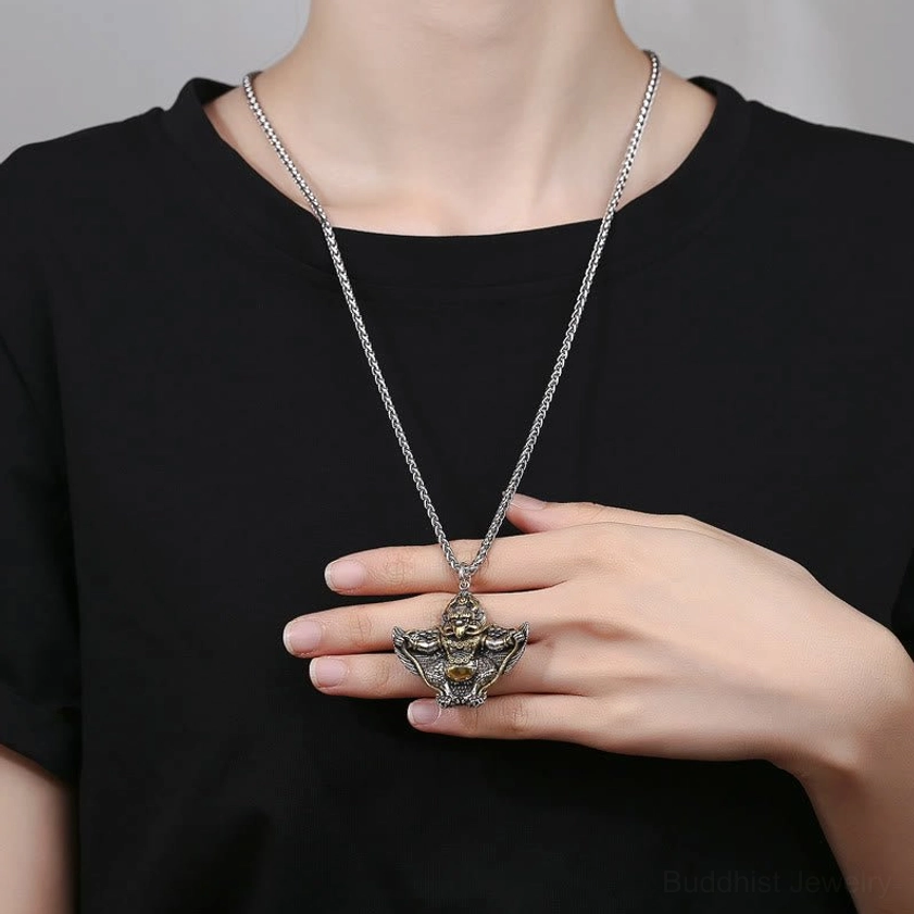 Garuda Bird copper necklace worn on person with black t-shirt showing pendant length and positioning