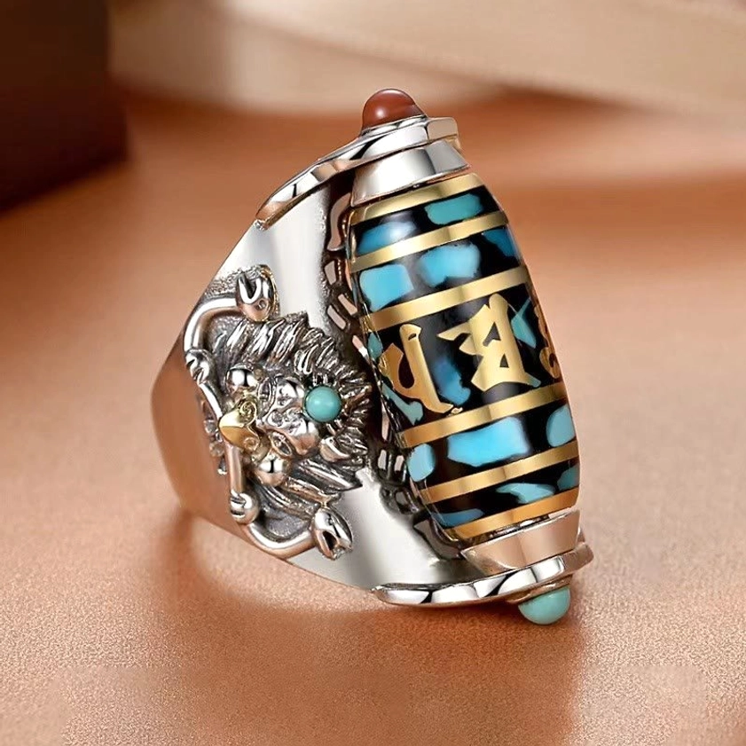 Sacred Garuda rotatable ring with multicolor turquoise gem inlays, right 3/4 angle detail shot