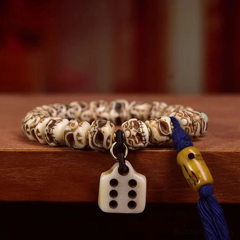 Handmade camel bone Garuda bracelet featuring natural carving details and elastic cord construction