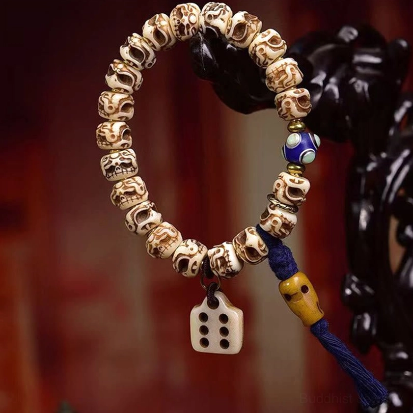 Garuda camel bone Buddhist protection bracelet full product view with tassel design and carved details