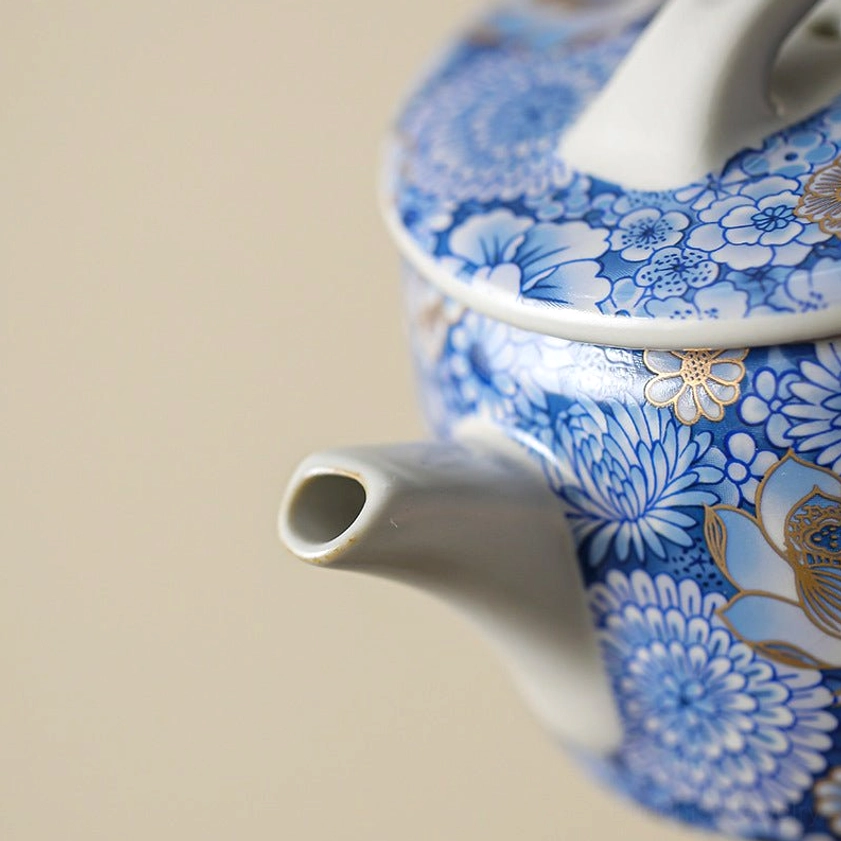Gilded porcelain teacup with plum blossom resilience symbolism Buddhist craft