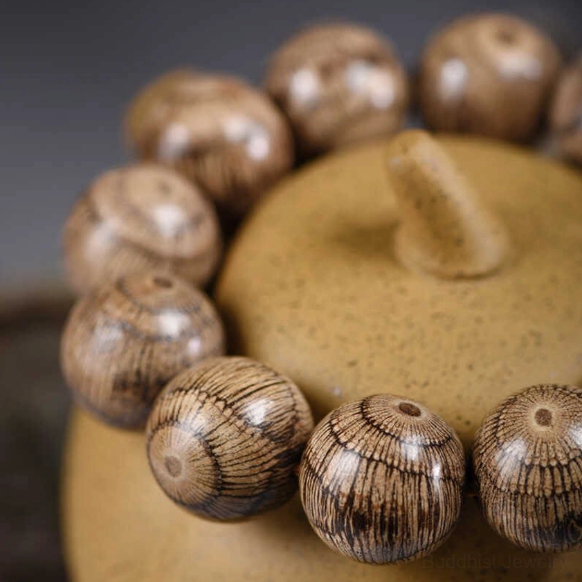Gnetum wood Buddhist bracelet featuring natural radial bead patterns ideal for meditation and spiritual protection