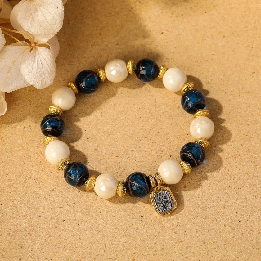 Beige porcelain with blue liuli glass bead Goddess of Wealth bracelet for abundance and clarity