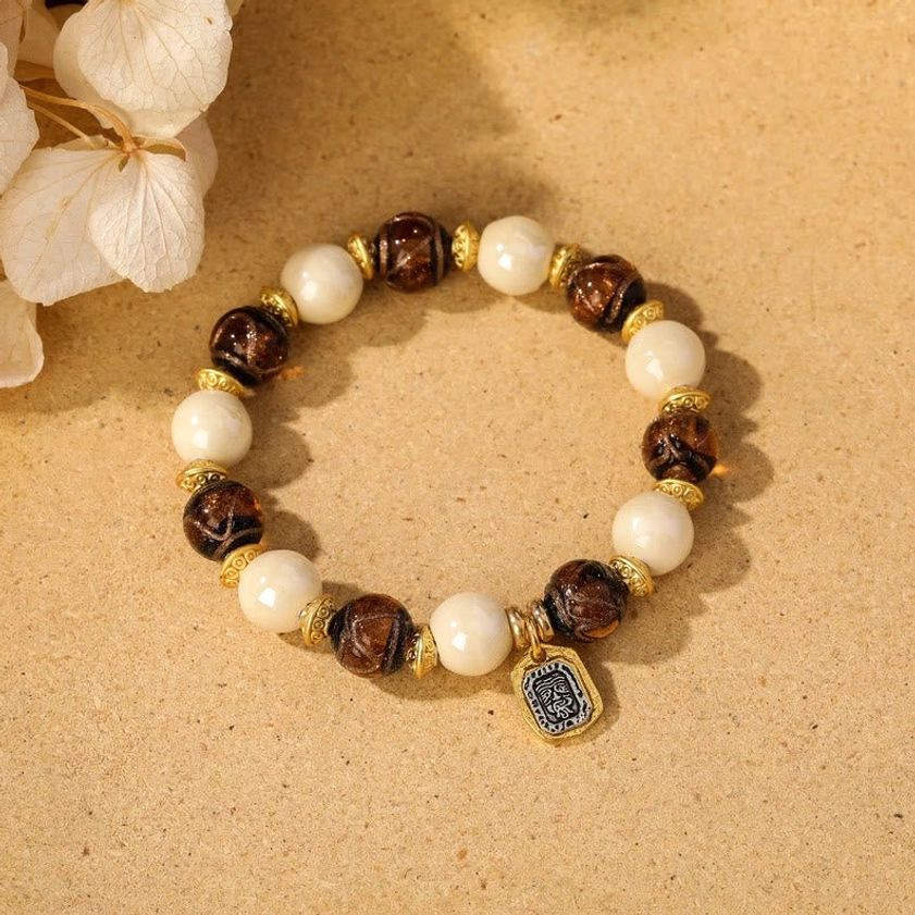 Beige porcelain with brown liuli glass bead Goddess of Wealth protection bracelet