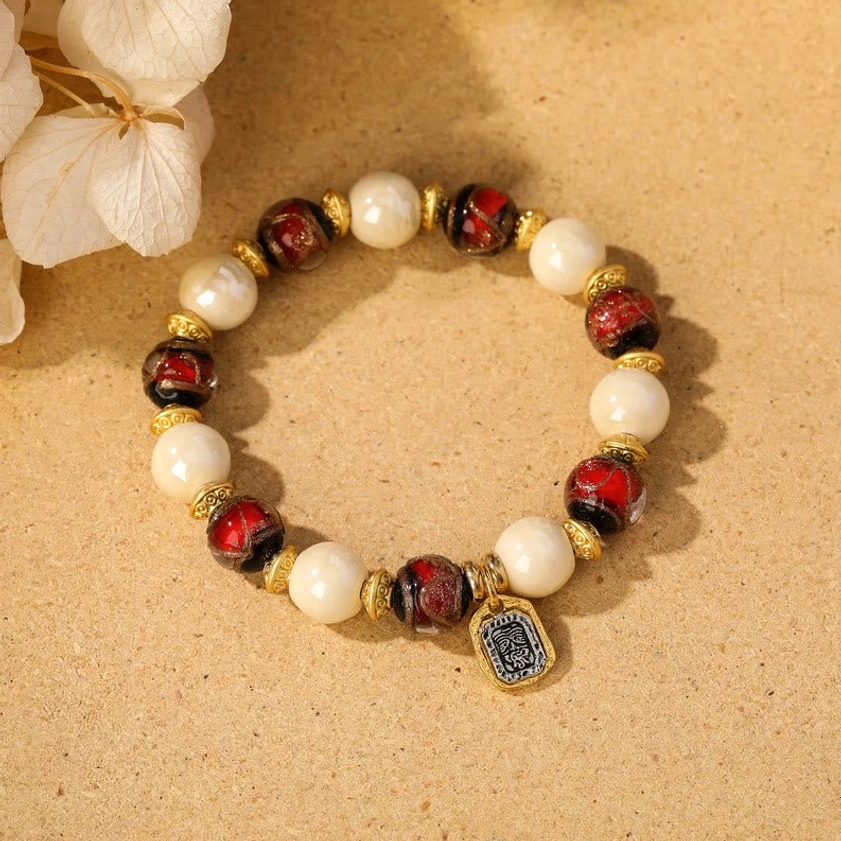 Beige porcelain with red liuli glass bead Goddess of Wealth charm bracelet