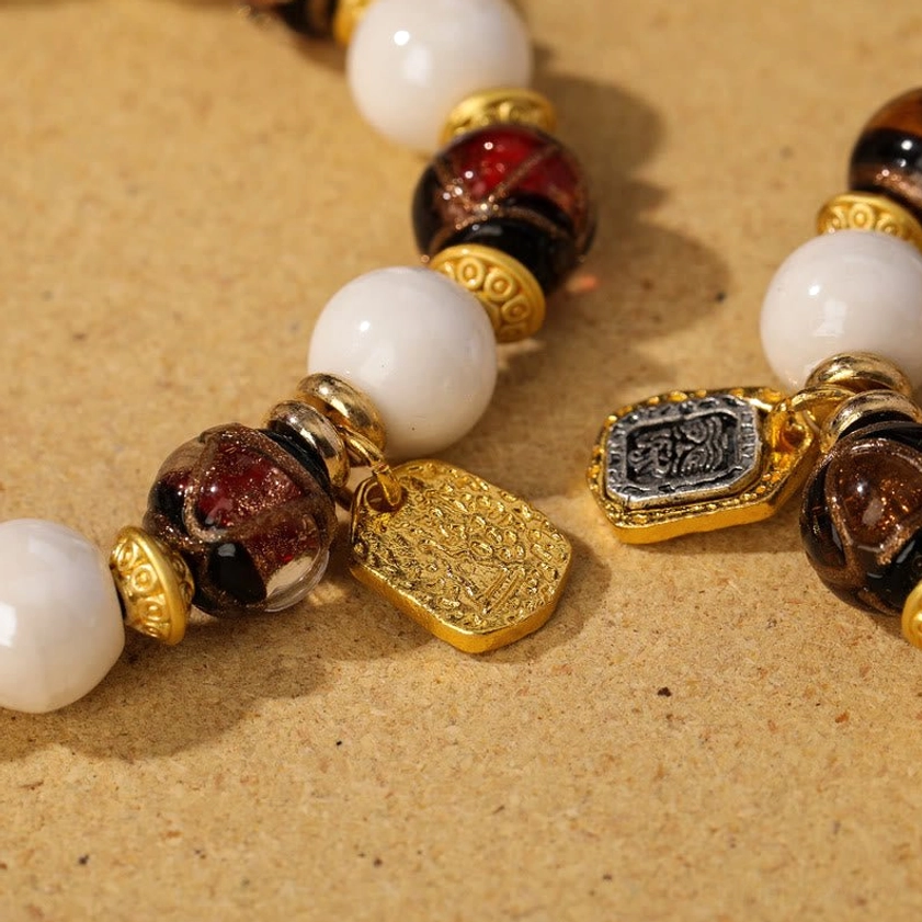Goddess of Wealth liuli glass and porcelain bead bracelet for prosperity, protection, and spiritual abundance