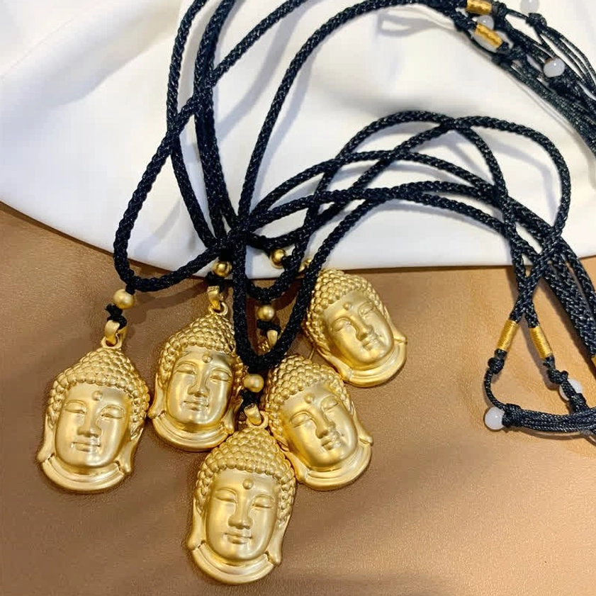 Gold Buddha head copper pendant necklace lifestyle shot showing spiritual mindfulness wear option
