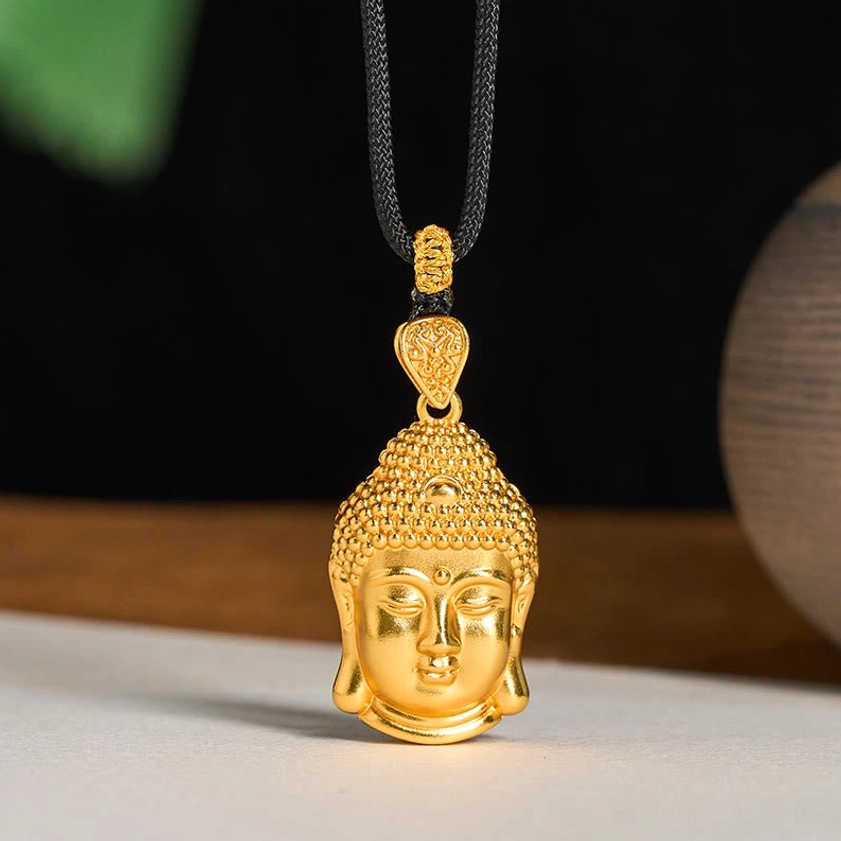Gold plated Buddha head pendant necklace front display with braided black cord