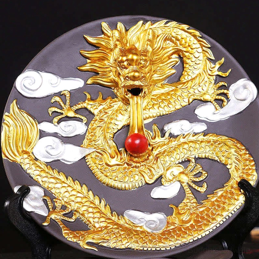 Close-up front view of golden dragon ceramic incense holder with intricate white cloud motifs