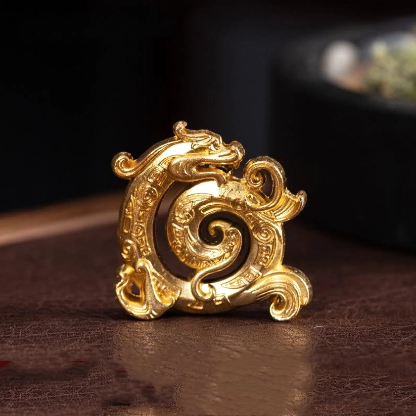 Gold dragon incense burner featuring polished finish and swirling dragon carvings, eye-level shot on dark wooden surface