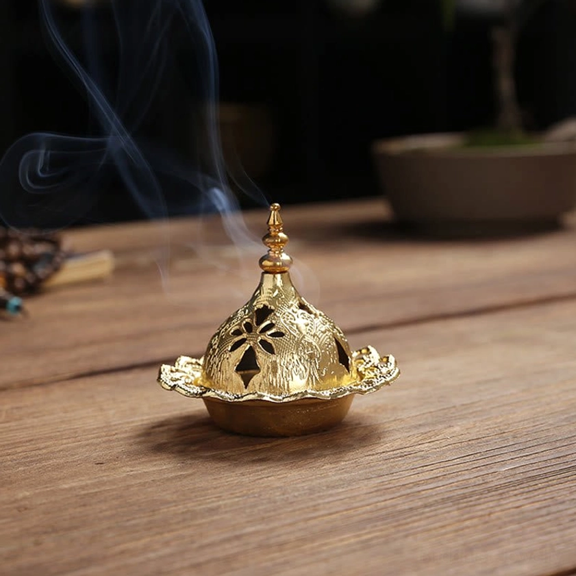 Single gold gourd incense burner with hollow carved patterns and scalloped tray