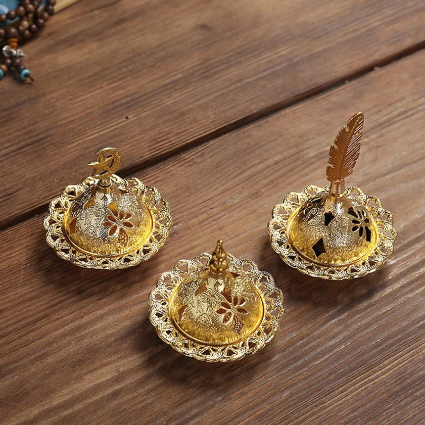 Gold incense holder displaying functional design for cone and stick incense meditation use