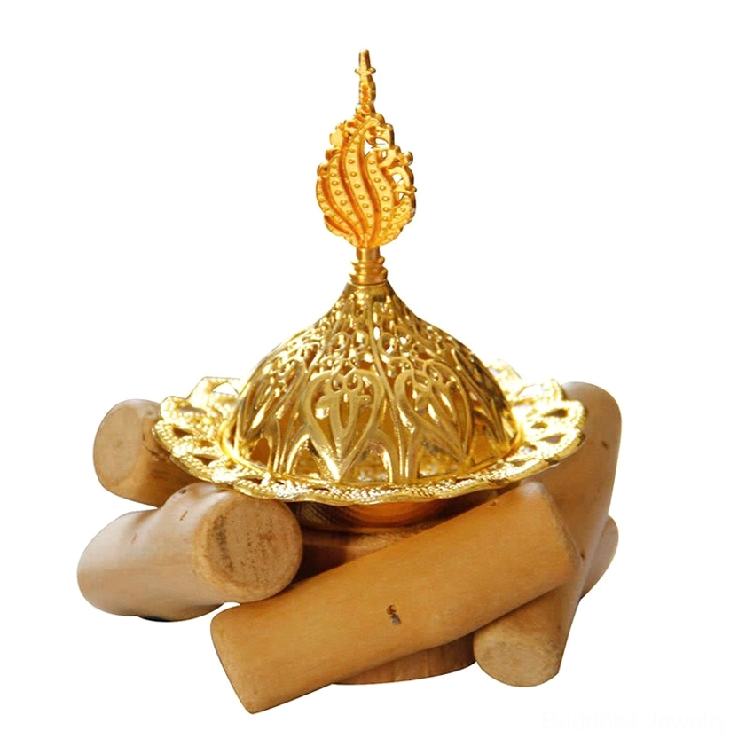 Gold incense burner with yoga mat and meditation cushions in peaceful yoga room - spiritual practice setting