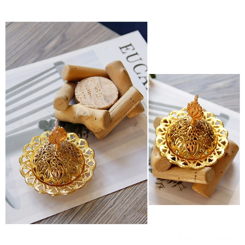 Gold incense holder comparison showing size and scale with wooden coaster - product measurement reference