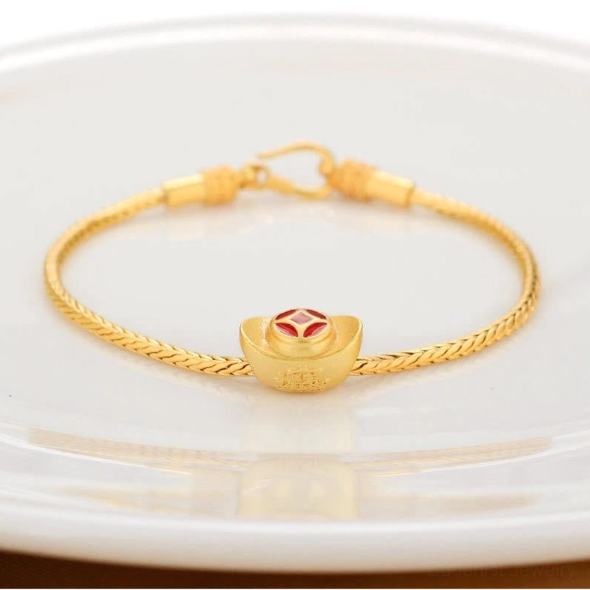 Buddhist bracelet featuring gold ingot Fu character charm with red enamel accent