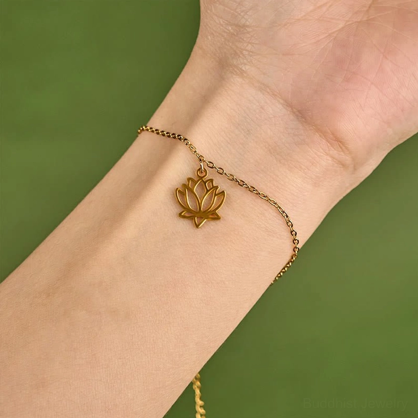 Premium gold tone lotus charm bracelet with polished finish and adjustable sizing