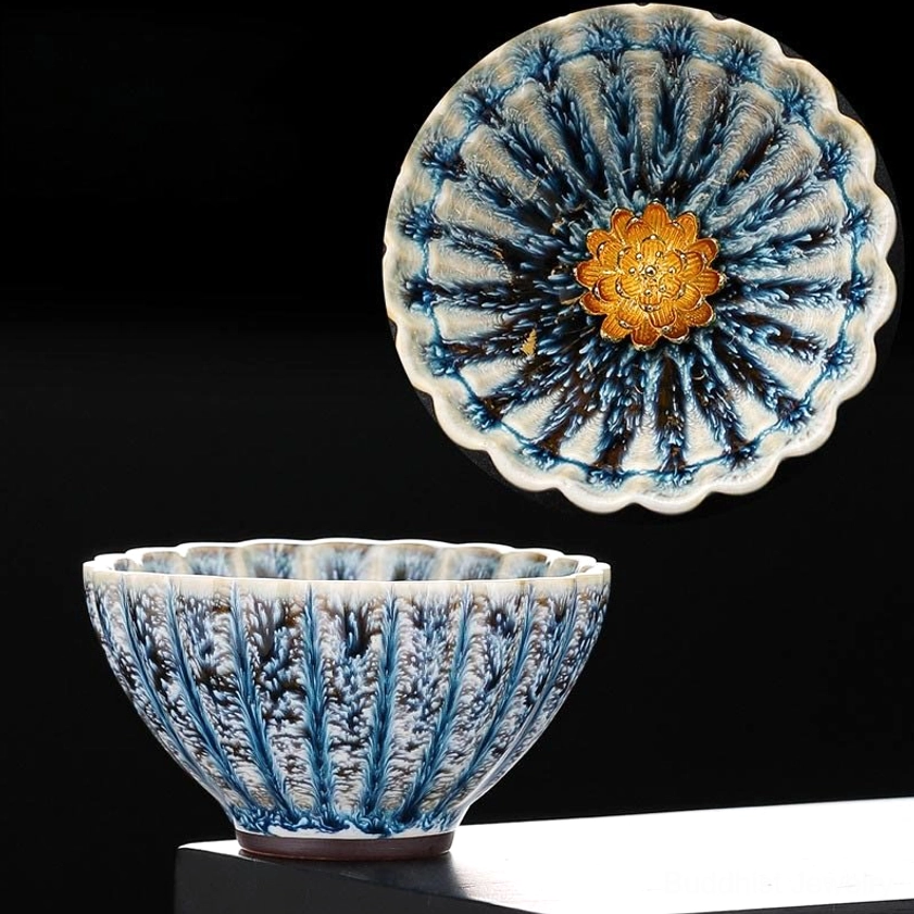 Gold lotus jian zhan ceramic teacup with fluted petal design and central gold flower ornament