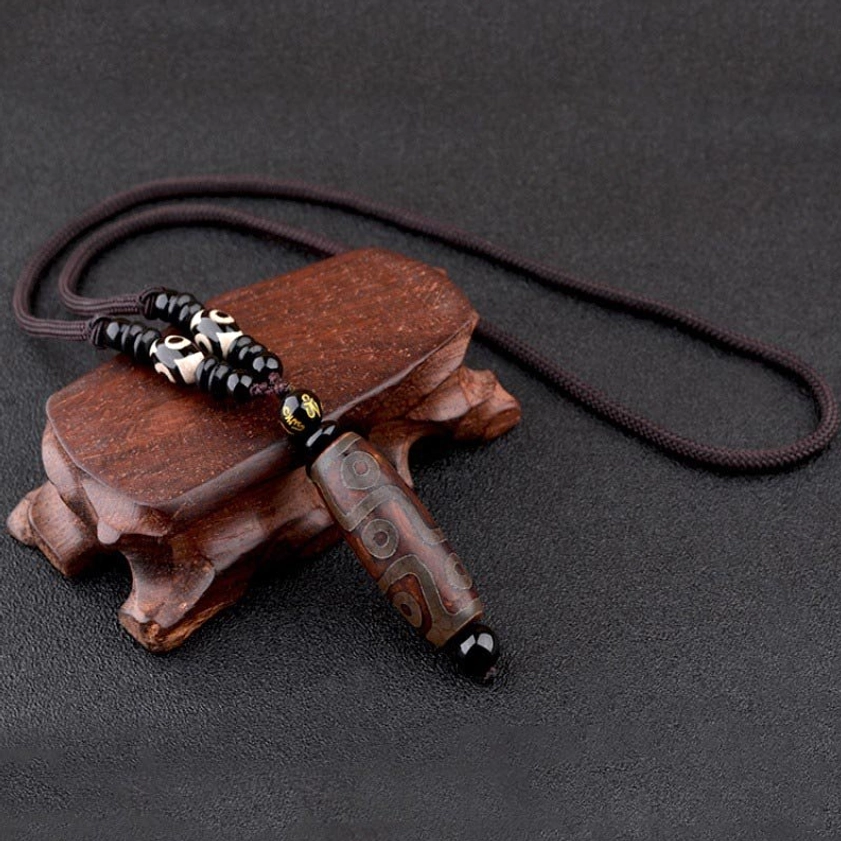 Gold nine-eye dzi bead Buddhist necklace pendant with hand-painted details and black braided cord