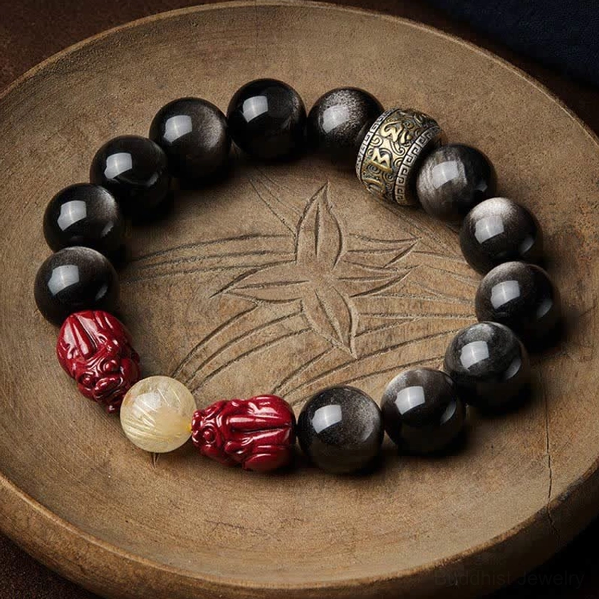 Gold sheen obsidian pixiu cinnabar Buddhist protection bracelet with om mani padme hum mantra spacer on wooden tray