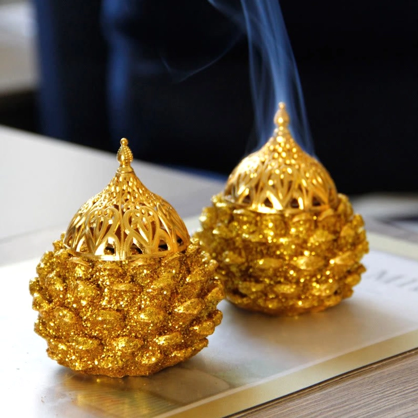 Gold pine cone incense burner compatible with backflow and traditional incense sticks for aromatherapy