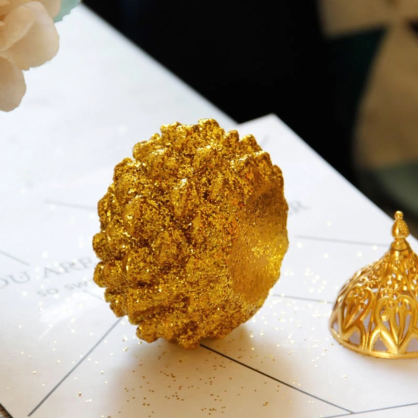 Gold pine cone incense burner in meditation room setting for Buddhist spiritual practice and mindfulness